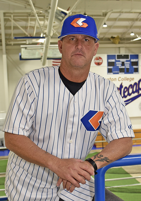 Baseball coach in uniform.