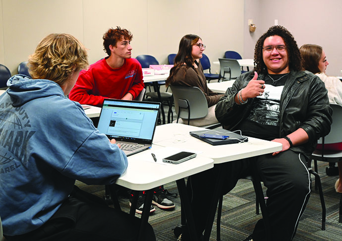 Galveston College students collaborating in a classroom at the college’s main campus in Galveston.