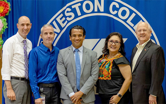 Five people stand together in celebration of Hispanic Heritage Month