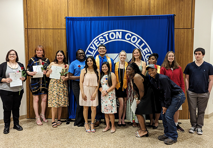 Group of students pose as inducted into Honors Society.