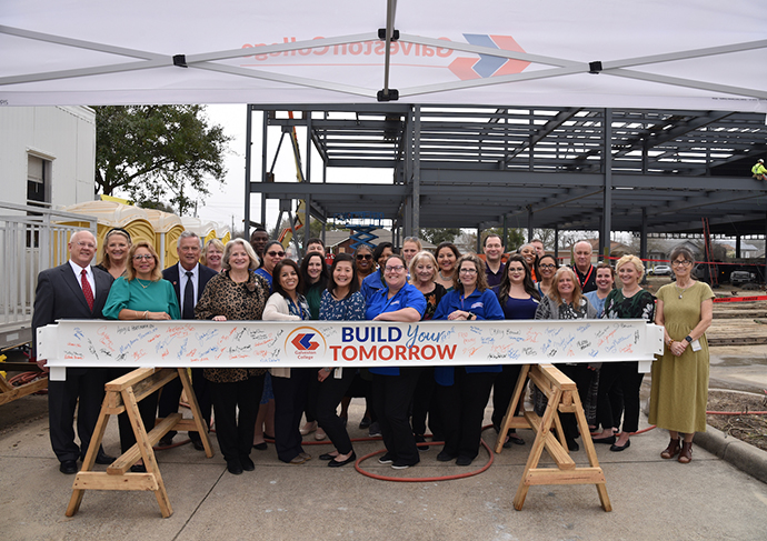 Galveston College Foundation board members, regents, donors and Allied Health faculty signed the beam to commemorate the construction milestone before it was raised into place by crane to the top of the highest point of the Health Sciences Education Center on Thursday, Jan. 17, 2023 at the Galveston College main campus.